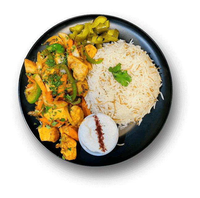 A plate featuring a serving of rice, mixed vegetables, and grilled chicken pieces arranged attractively.